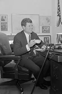 Edward Kennedy Smiling Holding a Cup and Saucer