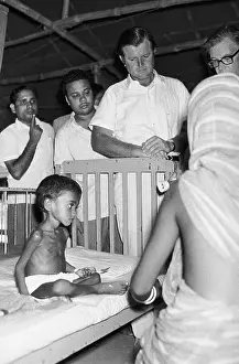 Starvation Prints: Edward Kennedy Visiting Malnourished Refugee Child