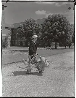 Wrapped Prints: Edward Lynch Carrying Wrapped Bicycle
