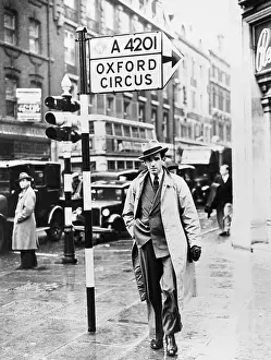 Edward R. Murrow Walking on a Sidewalk