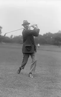Swinging Prints: Edward Ray Poses Swinging Golf Club