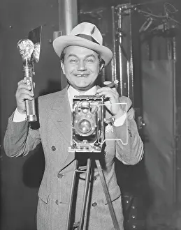 Edward G Prints: Edward Robinson Taking Photograph