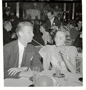 Edythe Wright Lighting Cigarette for Don Budge