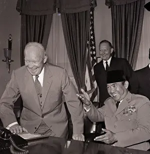 Sukarno Prints: Eisenhower Rises While Sukarno Points