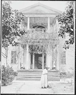 Old Age Prints: Elderly African American Sweeping in Front of Plantation Home