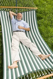 Retiree Prints: Elderly gentleman lying in a hammock and listening to music