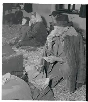 Elderly Hungarian Refugee and Others in Makeshift Camp