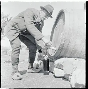 Belgrade Prints: Elderly Man Draining Brew from Barrel