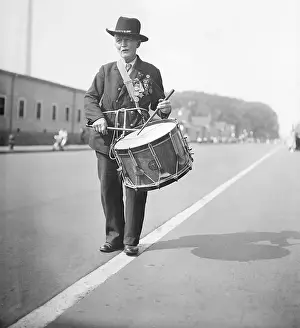 Captain Prints: Elderly Man Playing a Snare Drum