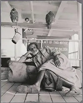 Elderly Man Resting on His Luggage