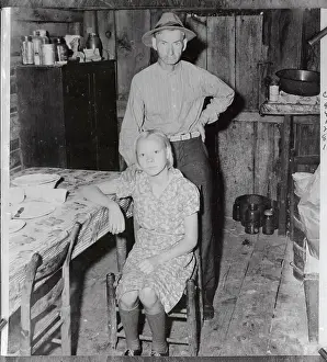 North Carolina Prints: Elderly Man Standing by His Young Wife