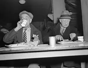 Elderly Men Eating at Table