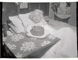 Elderly Trixie Friganza Sitting Next to Cake