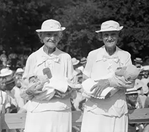 Similarity Prints: Elderly Twins Holding Twin Baby Boys