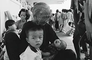 Elderly Woman Comforting Children