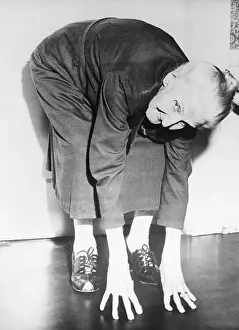 Maturity Prints: Elderly Woman Exercising