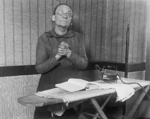 Old Age Prints: Elderly Woman Praying over Ironing Board