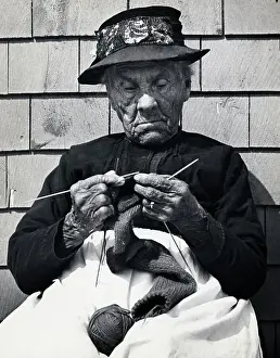 Elderly Woman Seated Knitting