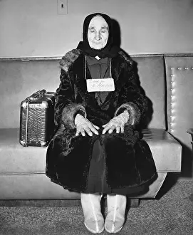 Elderly Woman Seated At Laguardia Field