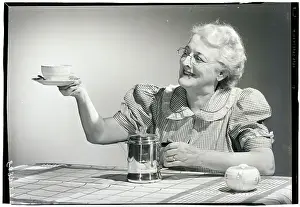 Coffee Prints: Elderly Woman Serving Coffee