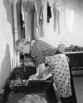 Washing Prints: Elderly Woman Washing Clothes On Board