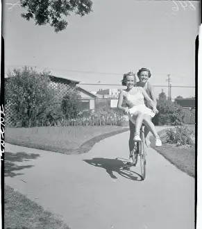 Eleanor Holm and Dorothy Lee Riding Bicycle