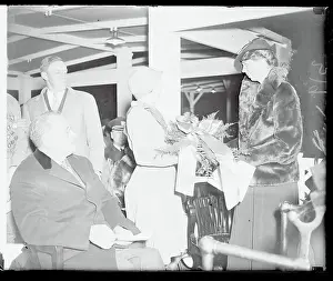 Prints of (Original Caption). Mrs. Roosevelt receives a Christmas floral offering from Girl Scout Pauline Martin, troop 23, on behalf of the Girl Scouts of America, while President Roosevelt looks A Timeless Christmas: Vintage Treasures: Eleanor Roosevelt Receiving a Floral Offering