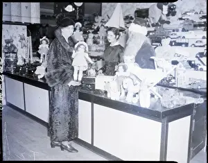 Counter Prints: Eleanor Roosevelt with Santa and Doll at Sales Counter