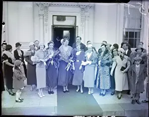 Eleanor Roosevelt and Women Stand with Flowers