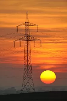 Images Dated 23rd March 2011: Electric power transmission lines, electricity pylon, with the setting sun, Beinstein near Stuttgart