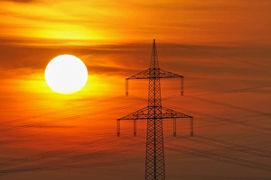 Electric power transmission lines, electricity pylon, with the setting sun, Beinstein near Stuttgart, Baden-Wuerttemberg, Germany, Europe Images Dated 23rd March 2011: Electric power transmission lines, electricity pylon, with the setting sun, Beinstein near Stuttgart