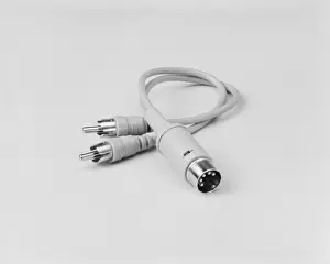 An electrical lead with a DIN end against white background, close-up