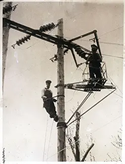 Pole Prints: Electrical Line Workers on Pole Platform