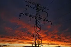 Images Dated 23rd June 2013: Electricity pylon against a red evening sky, Bavaria, Germany