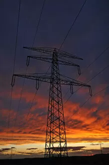 Images Dated 23rd June 2013: Electricity pylon against a red evening sky, Bavaria, Germany