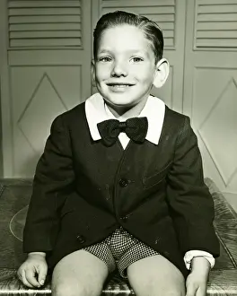 Black Colour Prints: Elegant boy (4-5) posing at home, (B&W), portrait