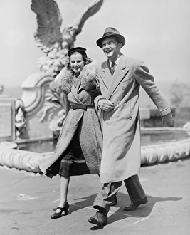 Arm In Arm Gallery: Elegant couple walking on promenade, (B&W)