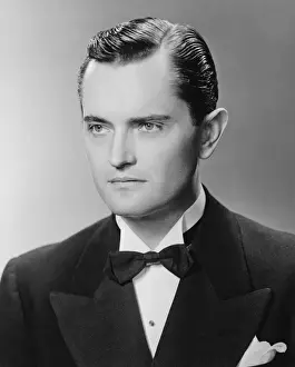 Looking Away Prints: Elegant man posing in studio, (B&W), close-up, portrait