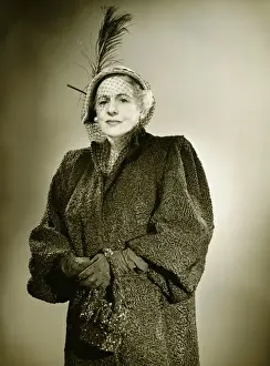 50 59 Years Prints: Elegant mature woman in hat and coat posing in studio, (B&W), (Portrait)