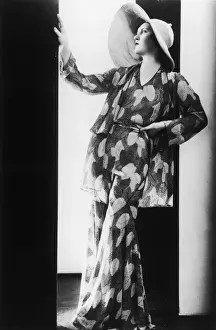 Prints of A woman wearing a leaf-pattern trouser suit and broad-brimmed sun hat, circa 1928. (Photo by FPG/Hulton Archive/Getty Images) Black and White Images Capturing the Essence of Mid-20th Century: Elegant Summer Suit
