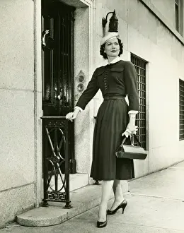 Purse Prints: Elegant woman posing at building entrance, (B&W), portrait