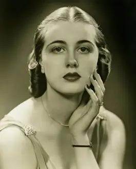 Sleeveless Prints: Elegant woman in sleeveless gown posing in studio, (B&W), portrait