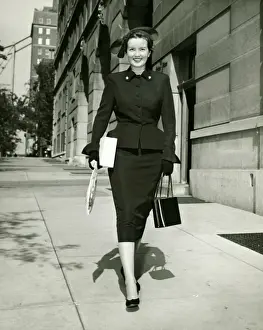 Sidewalk Prints: Elegant woman walking on sidewalk, (B&W)