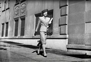 Purse Prints: Elegant woman walking on sidewalk, (B&W)