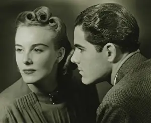 Elegant young couple posing, (B&W), close-up