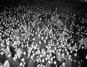 Cheering Prints: Elevated view of crowd at New Year's Eve outdoor party