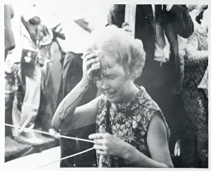 Elizabeth Evans Wiping Blood From Her Face