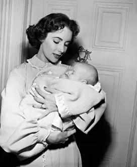 Elizabeth Taylor Holds Baby for Movie