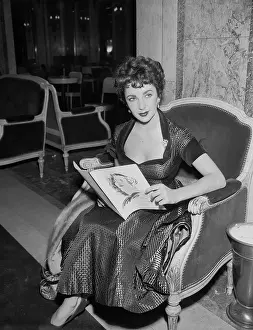 Elizabeth Taylor Sitting in Chair
