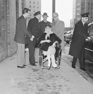 Elizabeth Taylor in Wheel Chair with Injured Leg